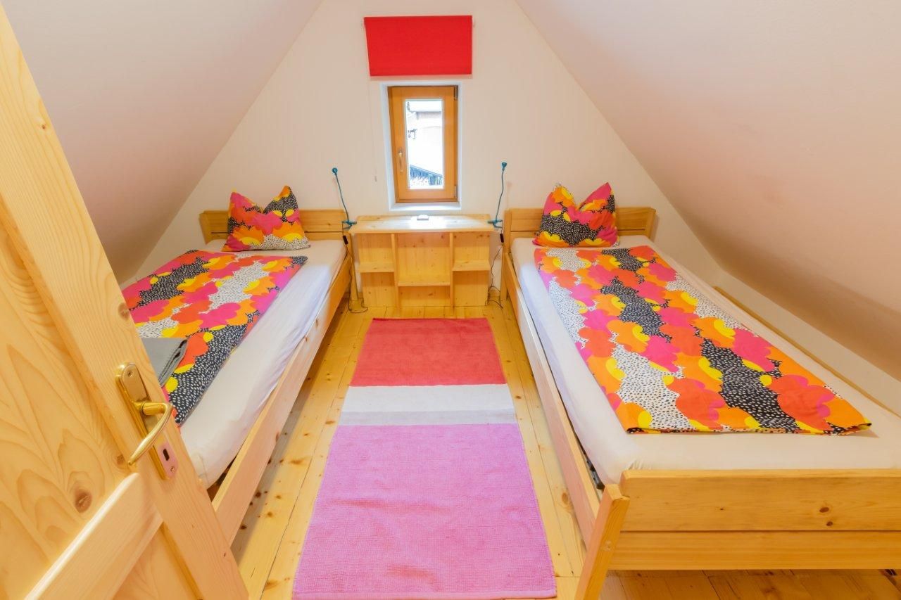 Room with two single beds