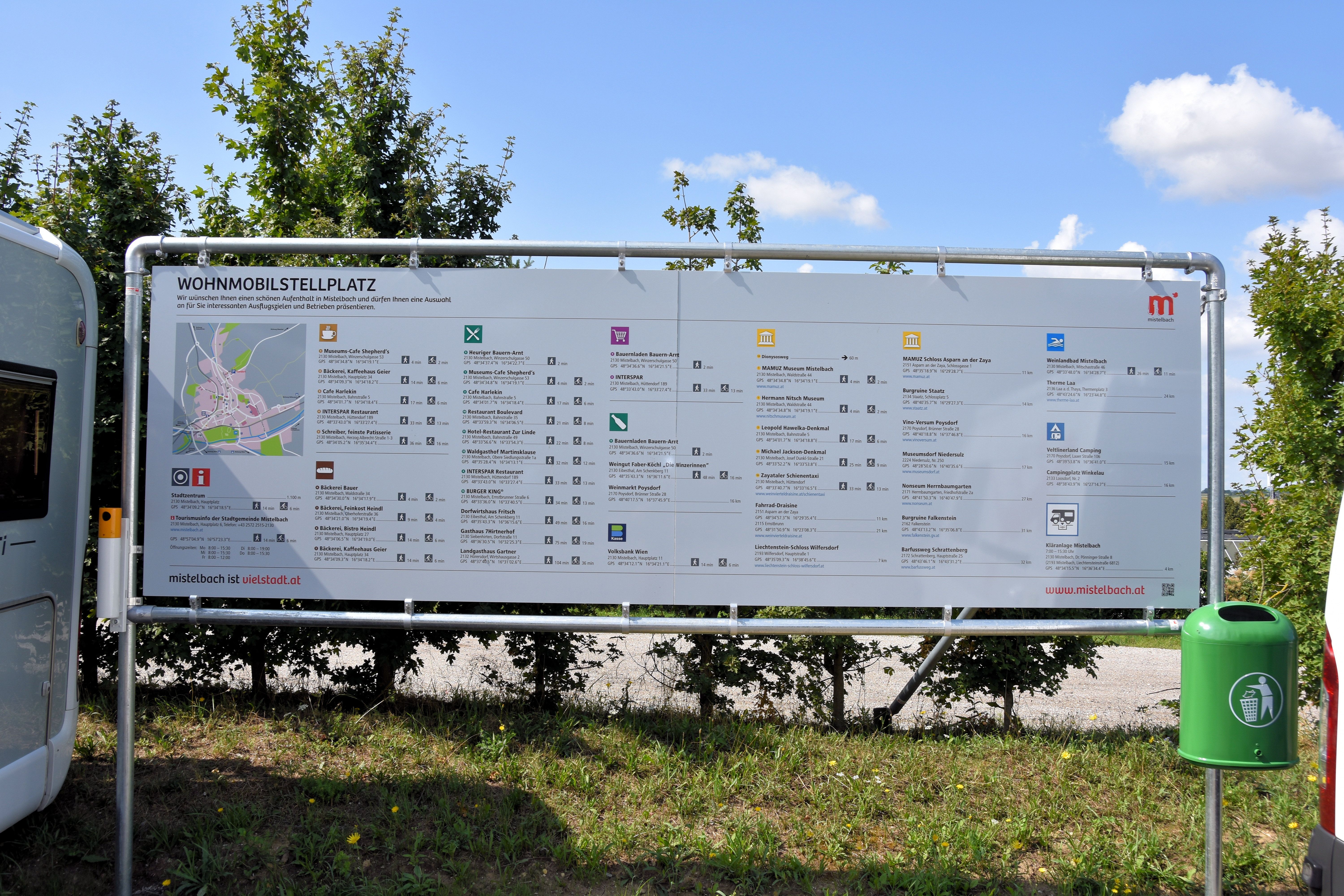 Information sign with map and text on a camper van site in Mistelbach.