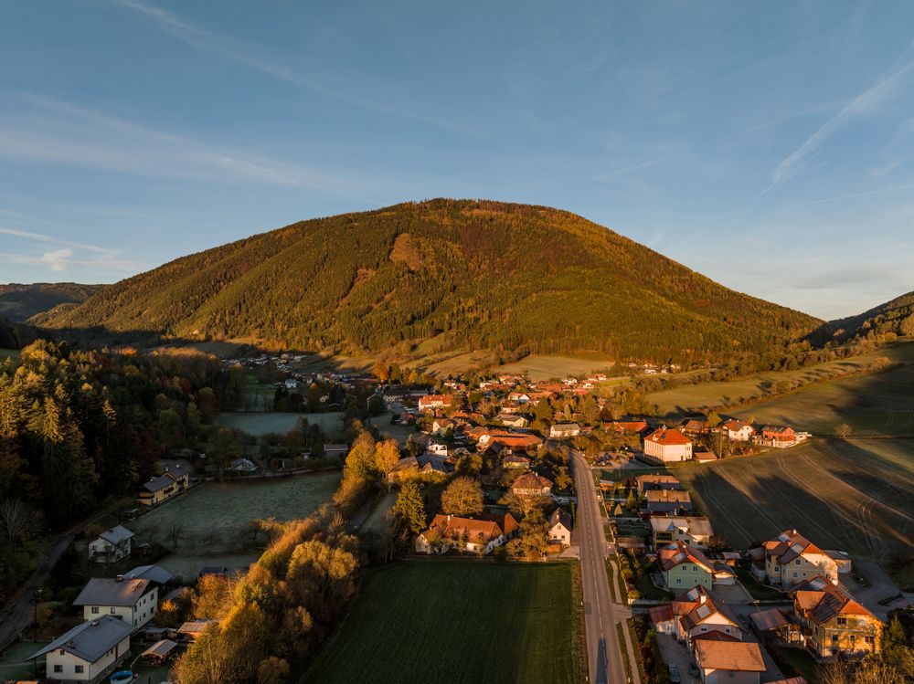 Aerial view of Otterthal with hill in the background.