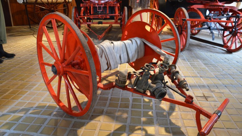 Historic fire hose reel in the St. Leonhard am Forst Fire Brigade Museum.