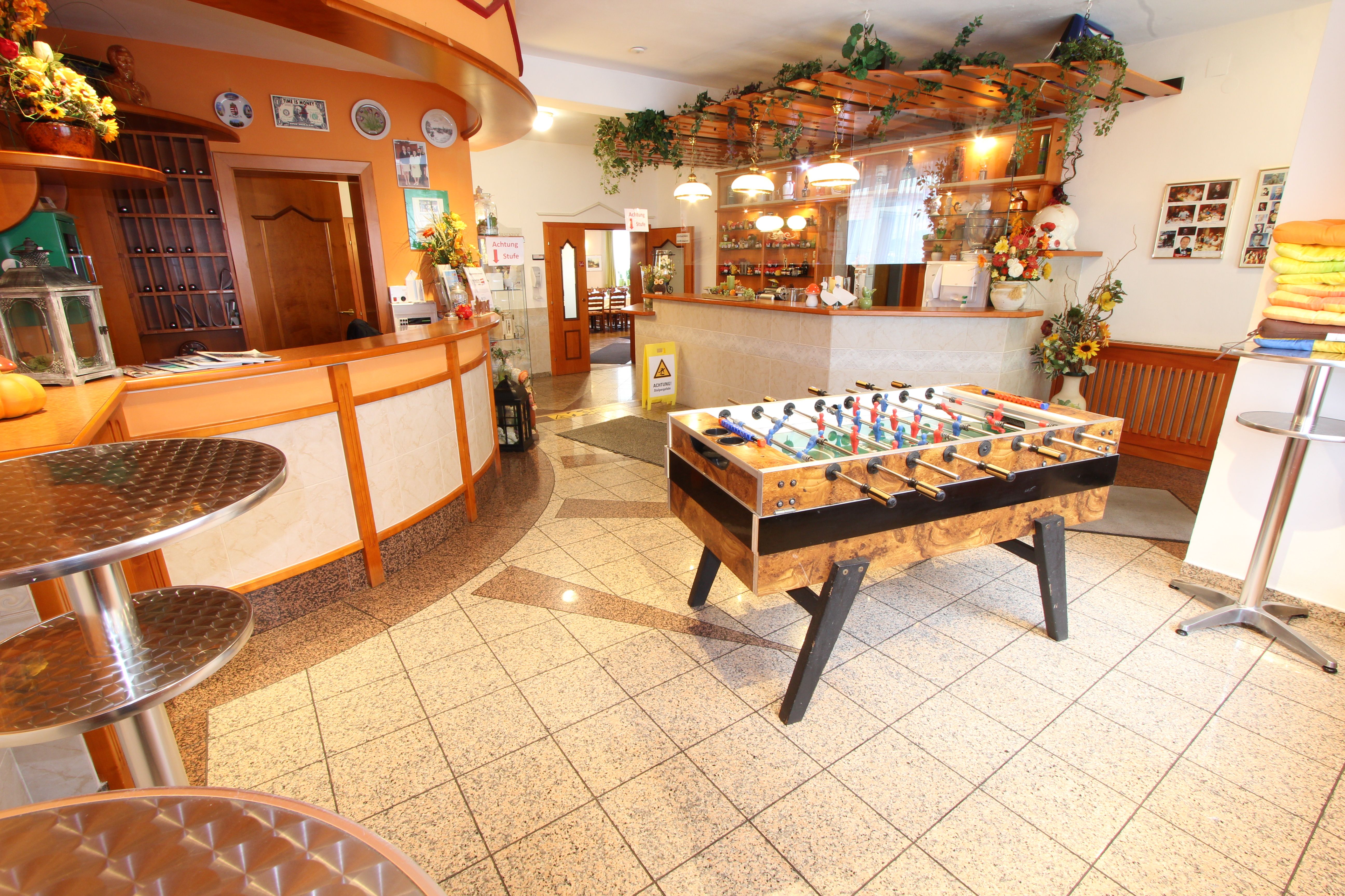 Reception area with table football table and bar.