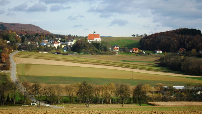 Landscape with church and fields in Gerolding, Austria.