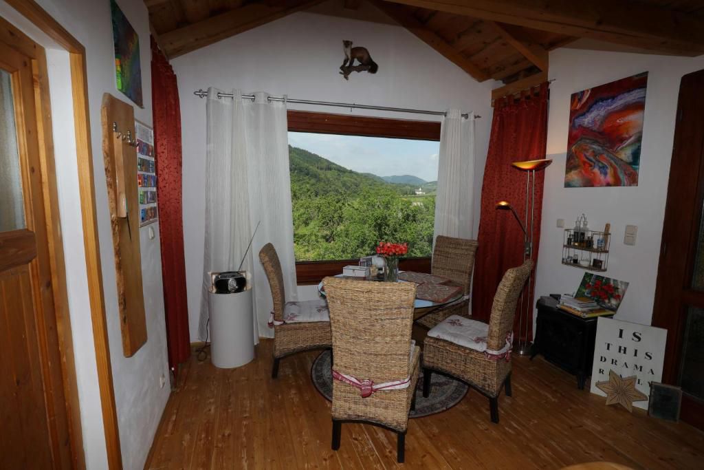 Chairs with table in front of a window