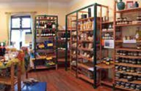 Interior view of a farm store with shelves full of products.