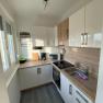 Bright kitchen with window and electrical appliances