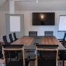Seminar room with table and chairs and screen