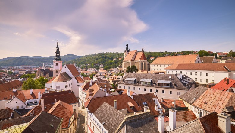 Panoramic view of the old town of Krems with churches and red roofs.