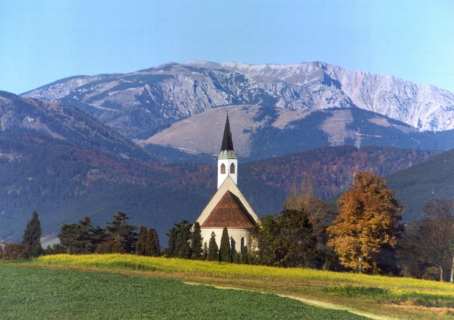 Church in front of a mountain landscape in Ternitz, Austria.