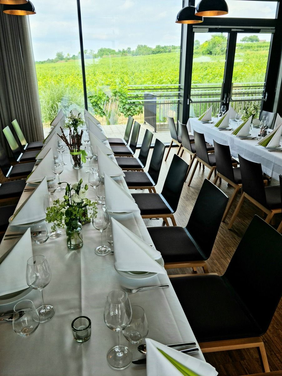 Elegant table setting in a room with a view of the vineyards.