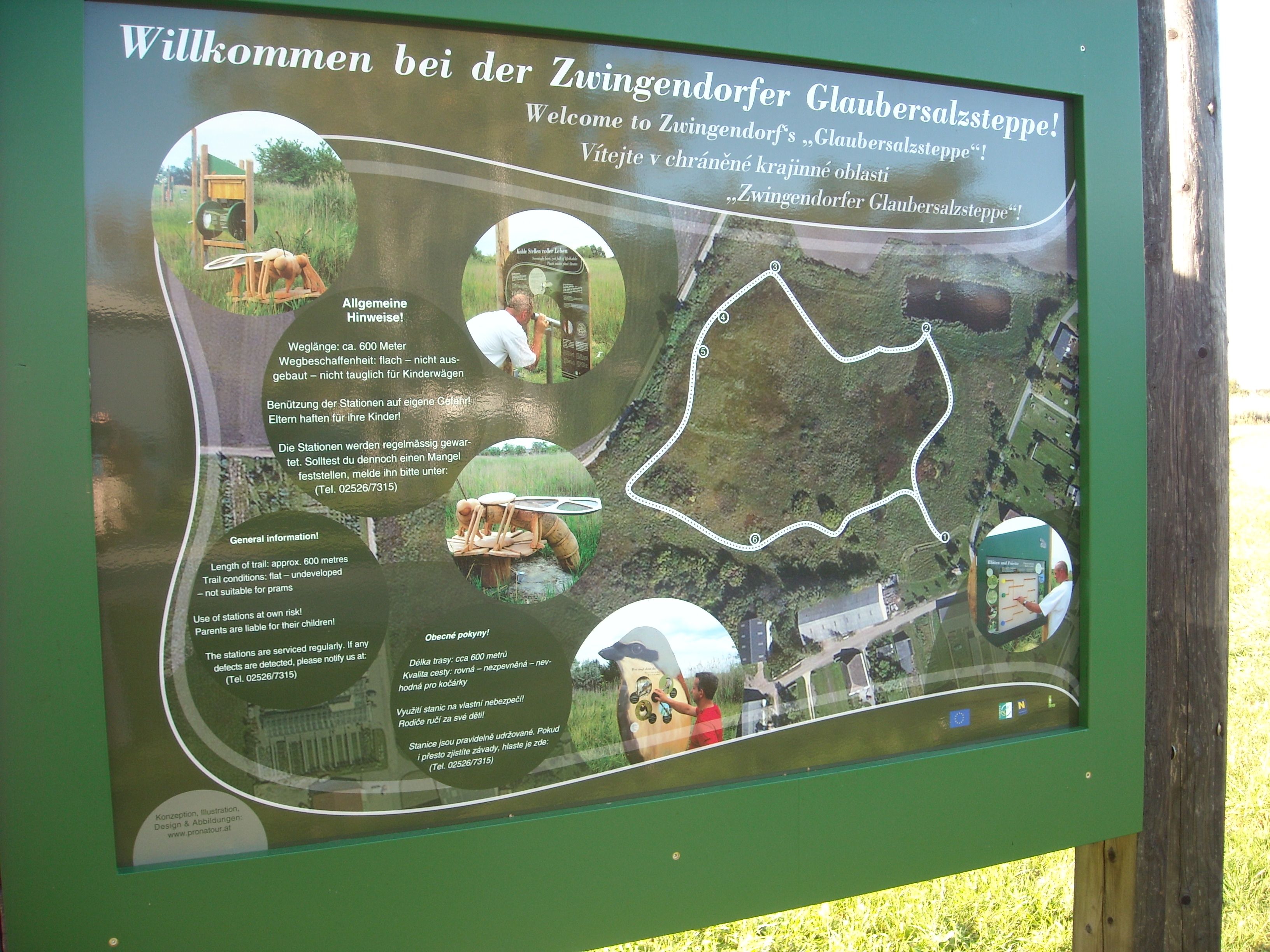 Information board of the Zwingendorf Glauber's salt steppe nature trail with map and information.