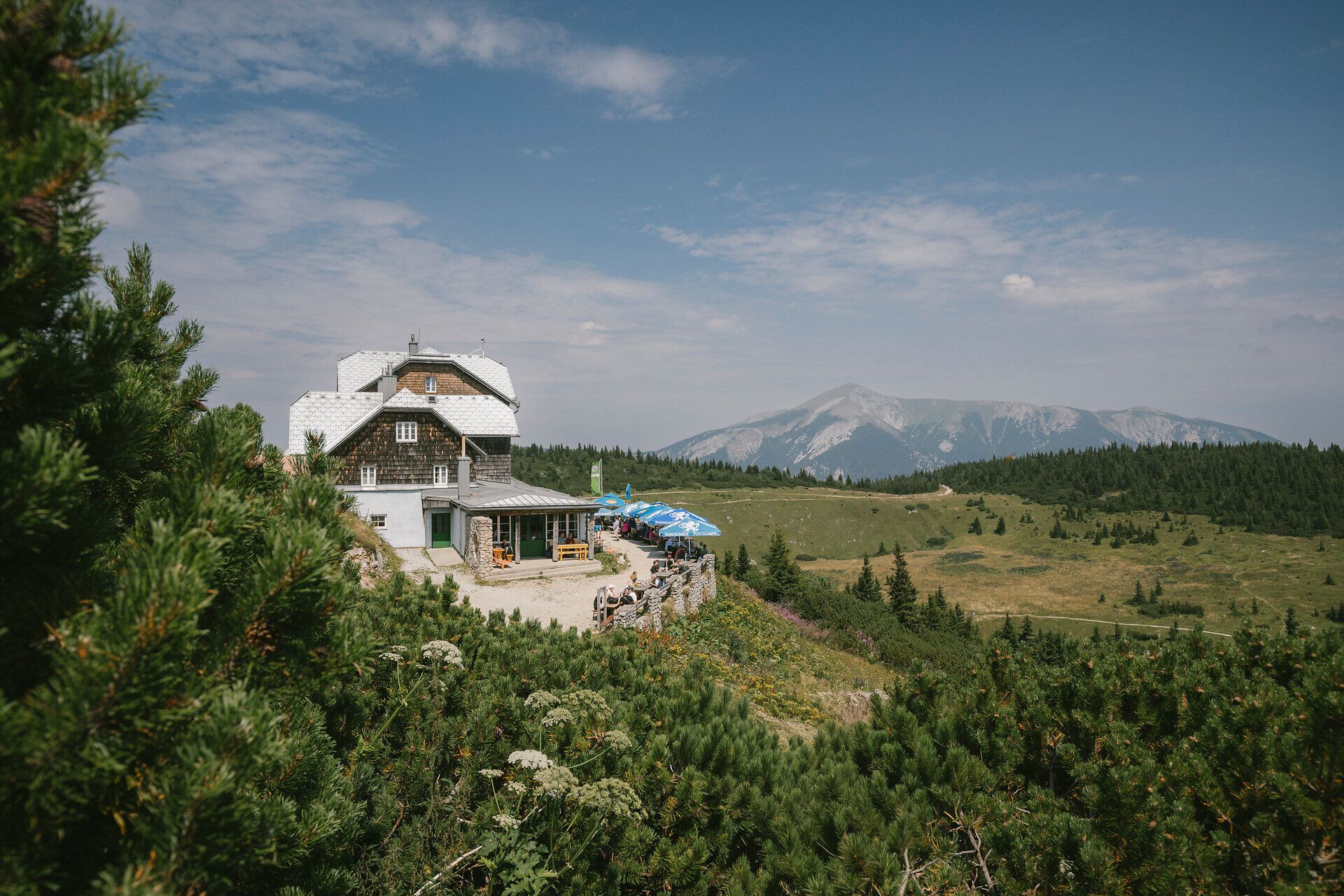 Exterior view of the Ottohaus on the Rax with a panoramic view of the mountains