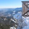 Winter views of snow-covered mountains and valleys from the Ottohaus viewing platform.