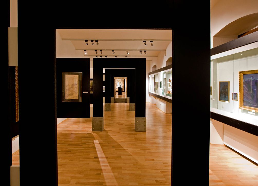 Interior view of the St. Pölten City Museum with exhibits and paintings.