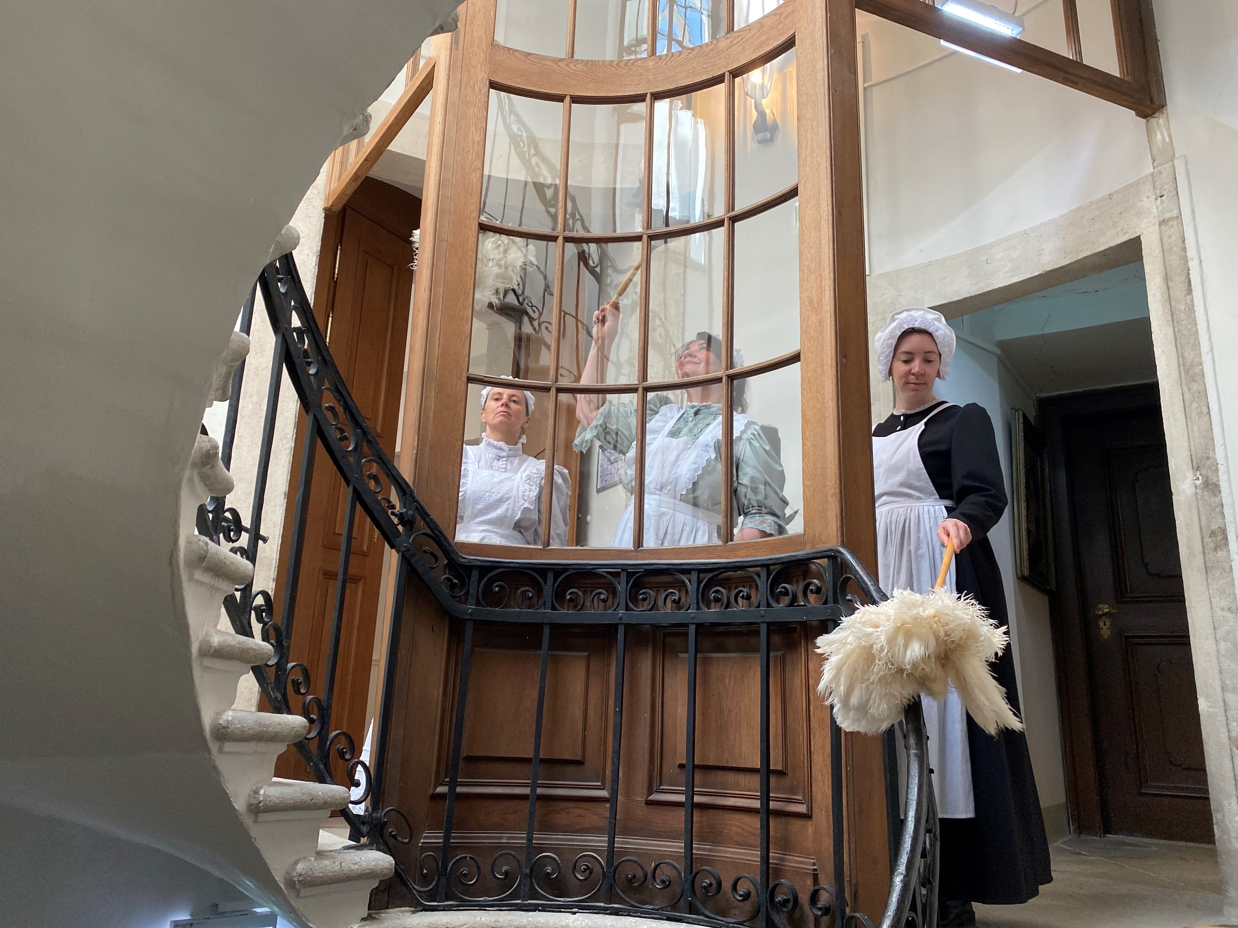 Three ladies in maid's clothing for a special tour of Eckartsau Castle.