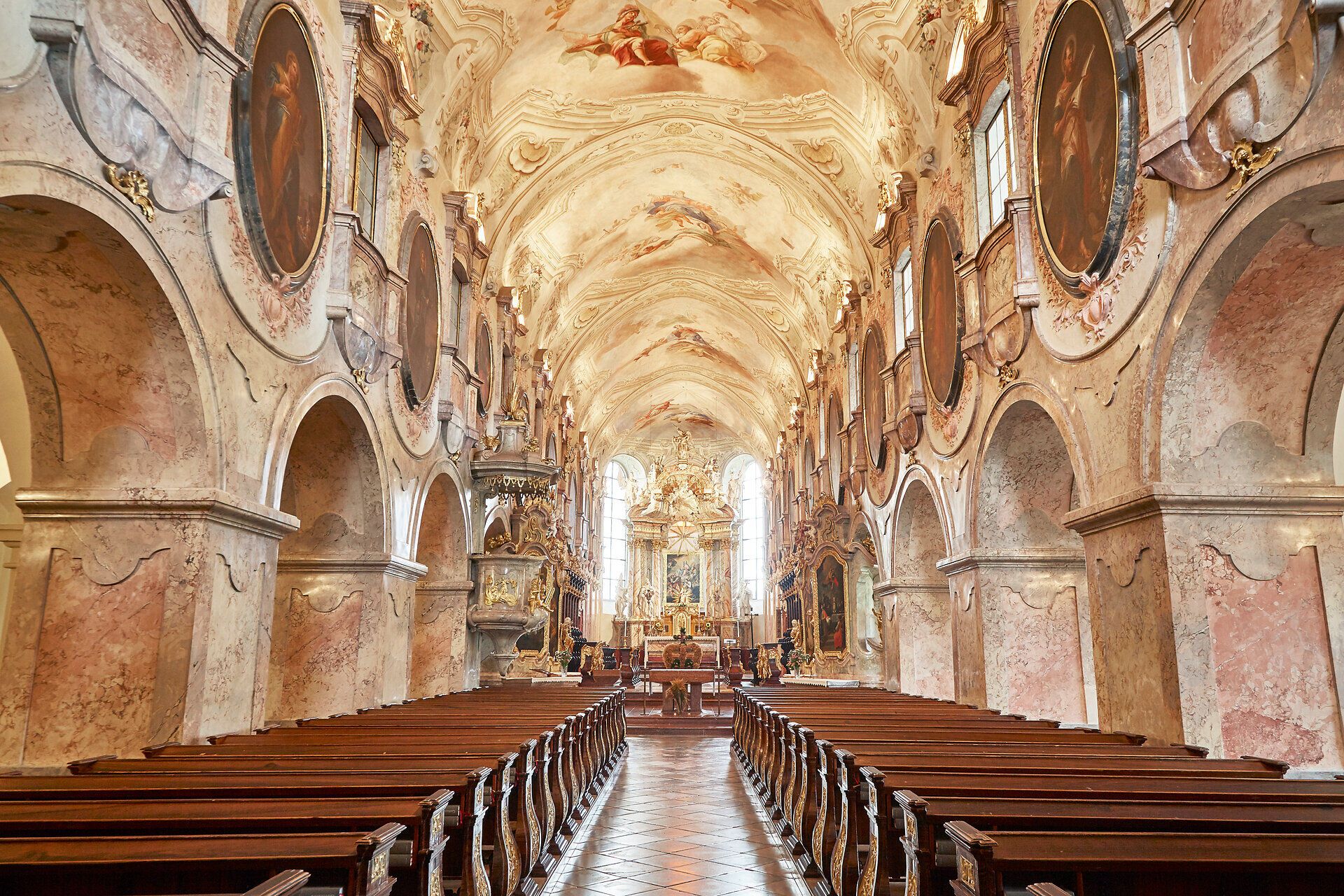 Interior view of the baroque church of Geras Abbey with ornate frescoes and decorations.