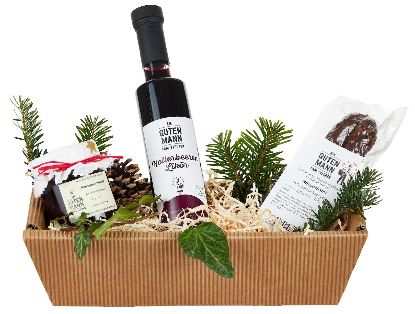 Gift basket with liqueur, jam and sausage, decorated with fir branches.