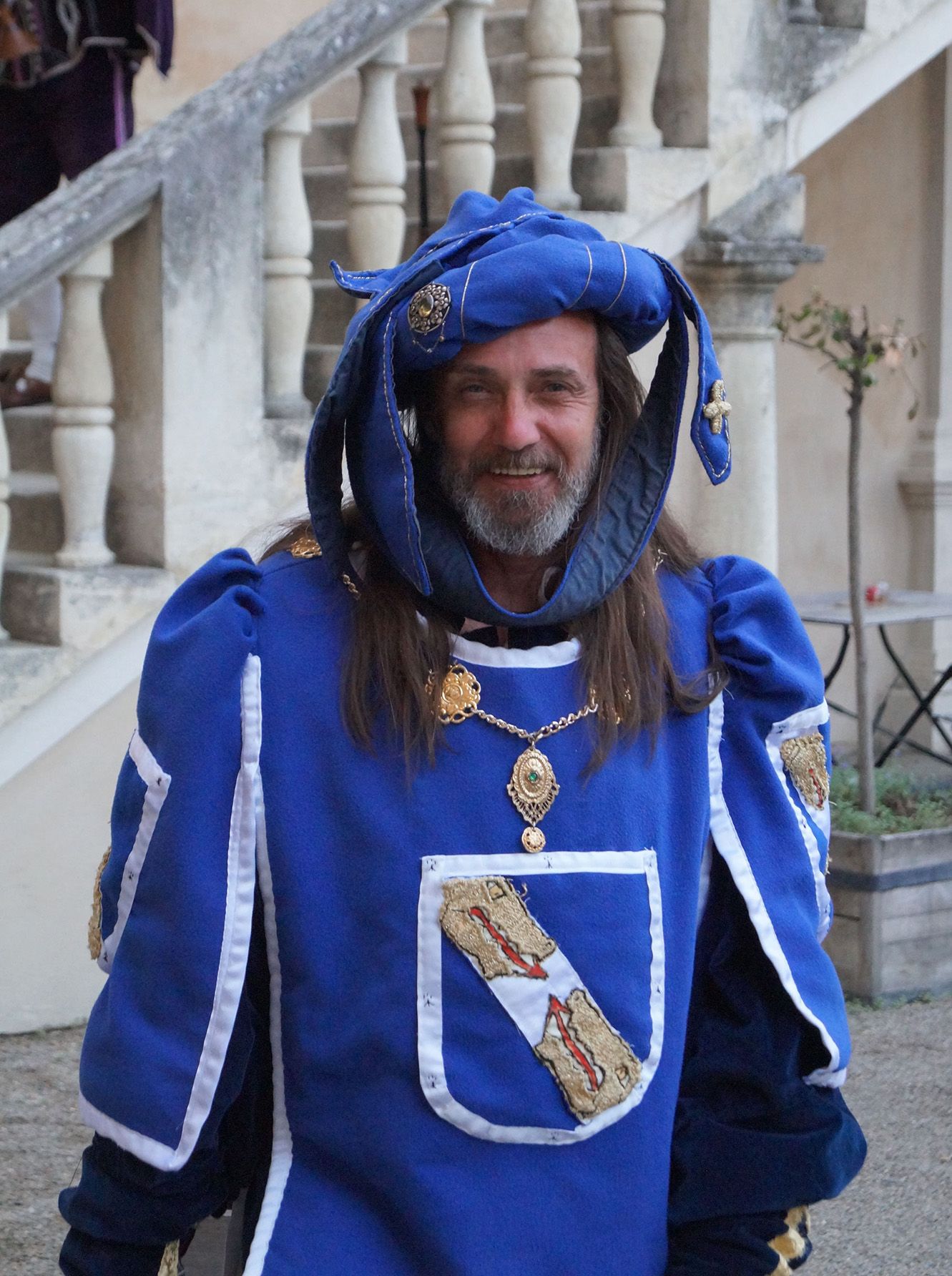 Person in medieval dress at a knight's dinner at Rosenburg Castle.