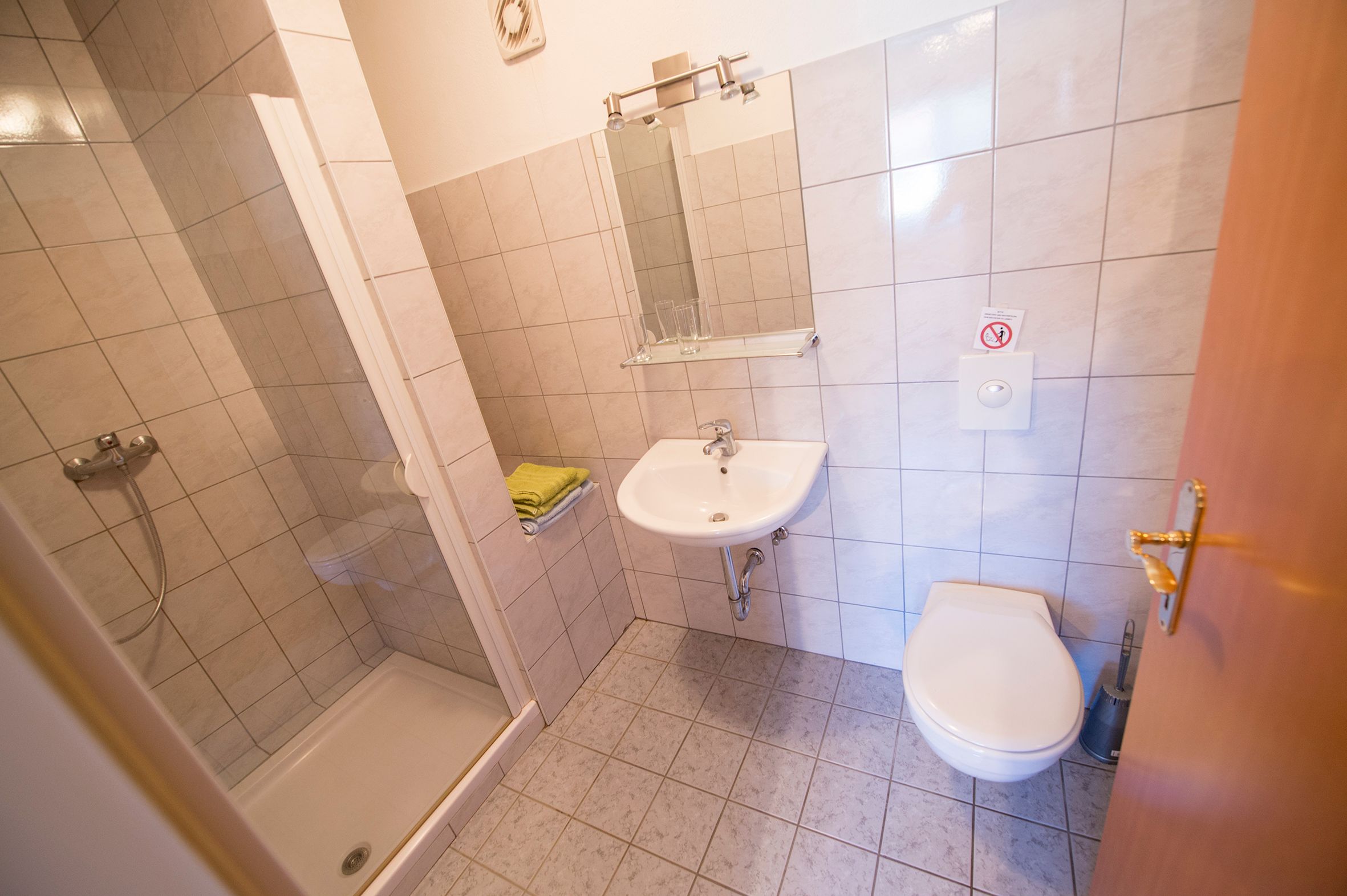 Further bathroom with WC, shower and toilet.