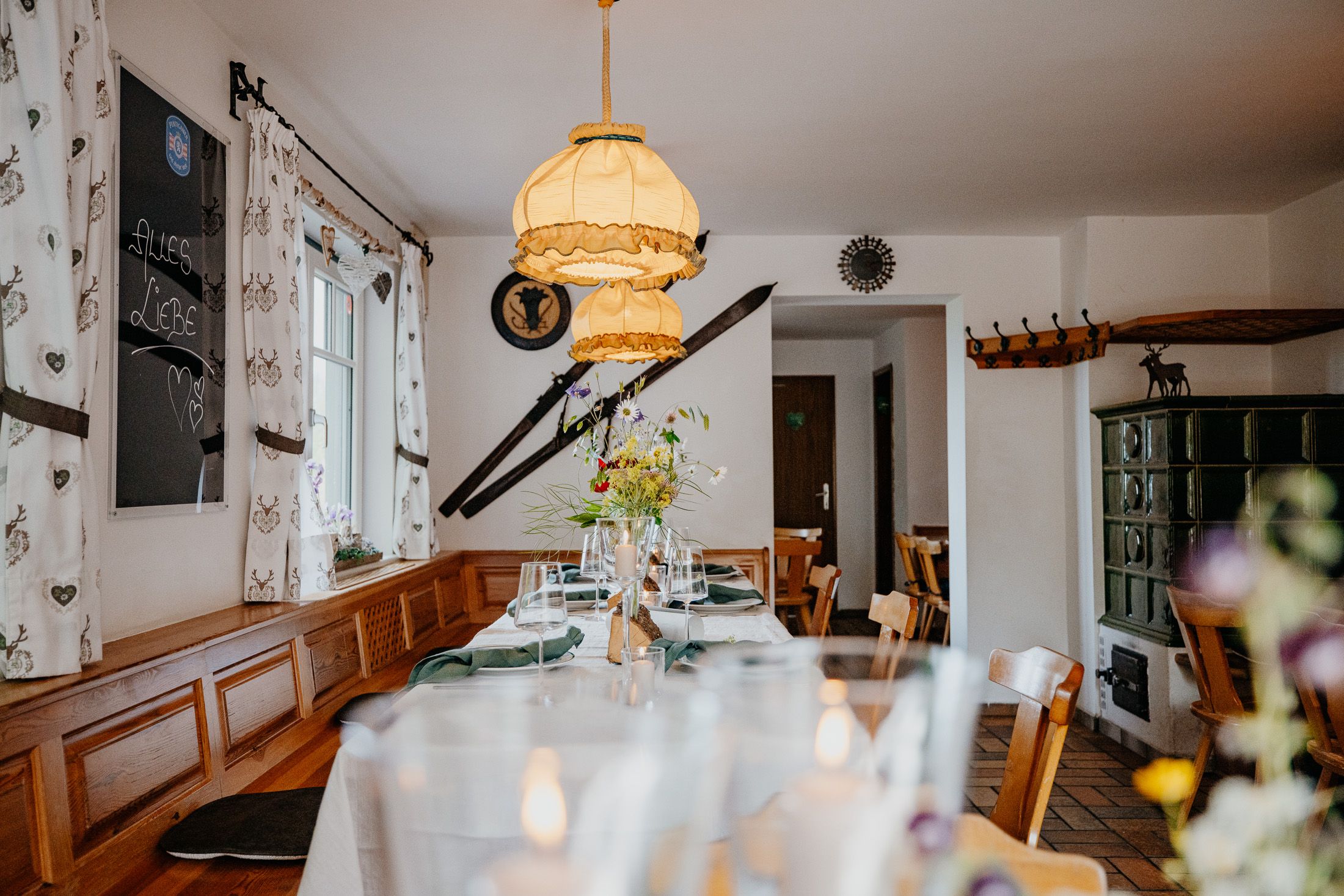 Cozy dining room with wooden furniture, table decorations and rustic details.