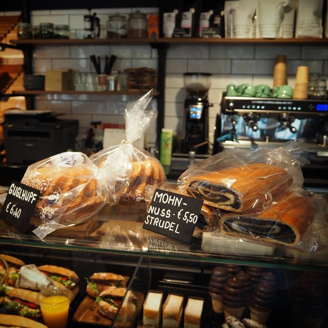Bakery display with Guglhupf and poppy seed and nut strudel.