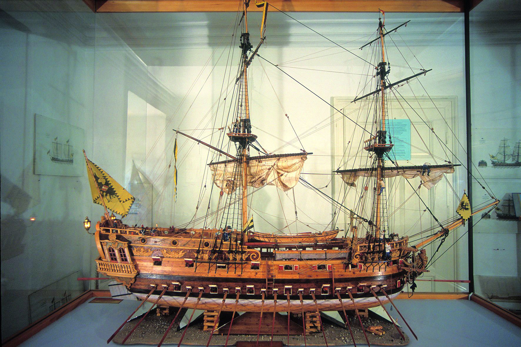 Model of a historic sailing ship in a glass display case in the Maritime Museum.