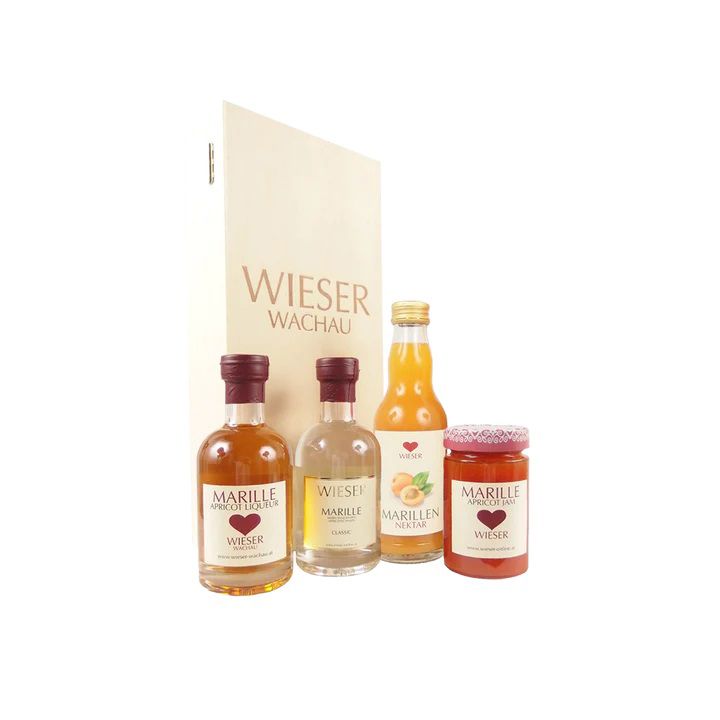 Four Wieser apricot products in front of packaging.