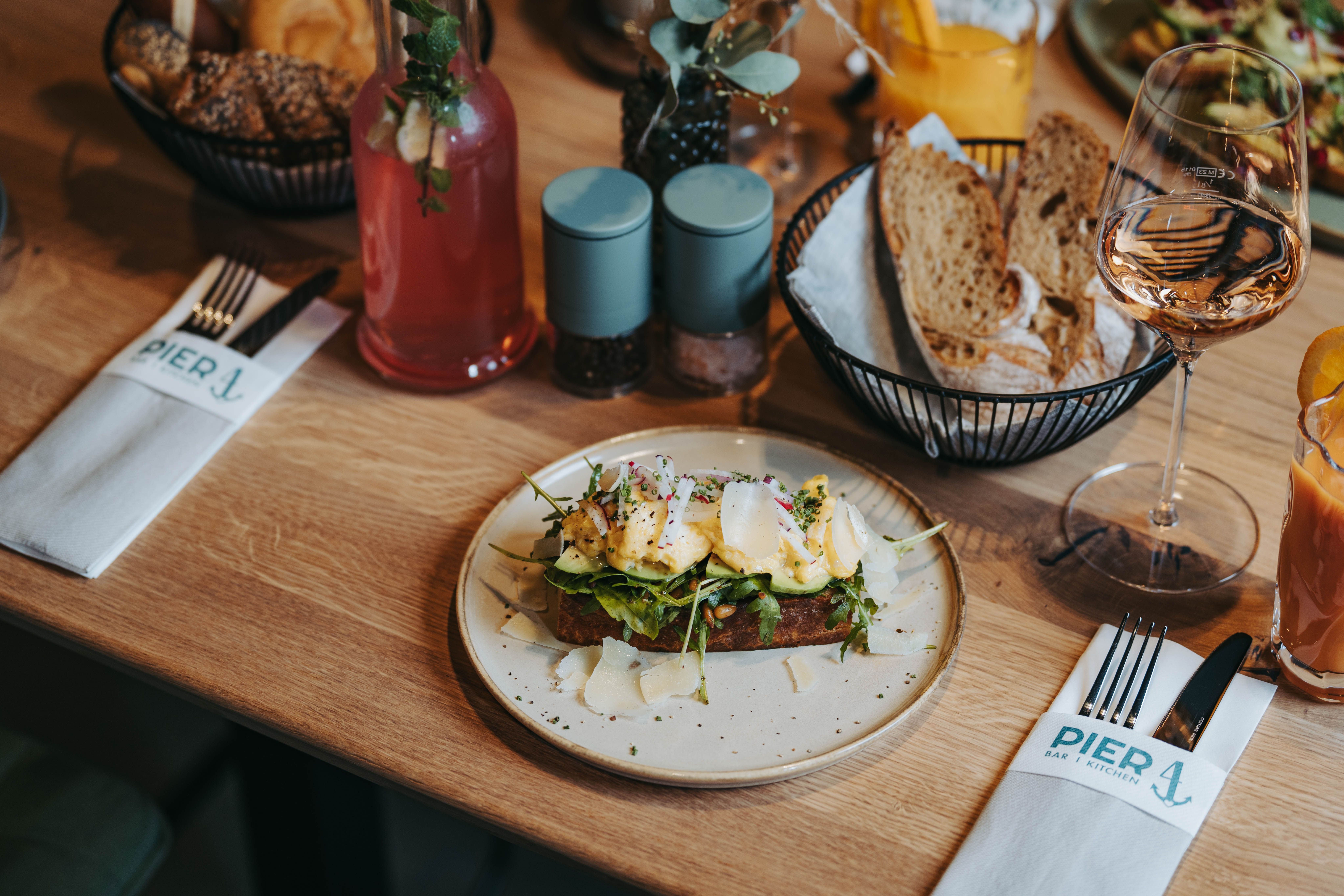 A laid table with a sandwich, drinks and cutlery in the Pier 4 restaurant.