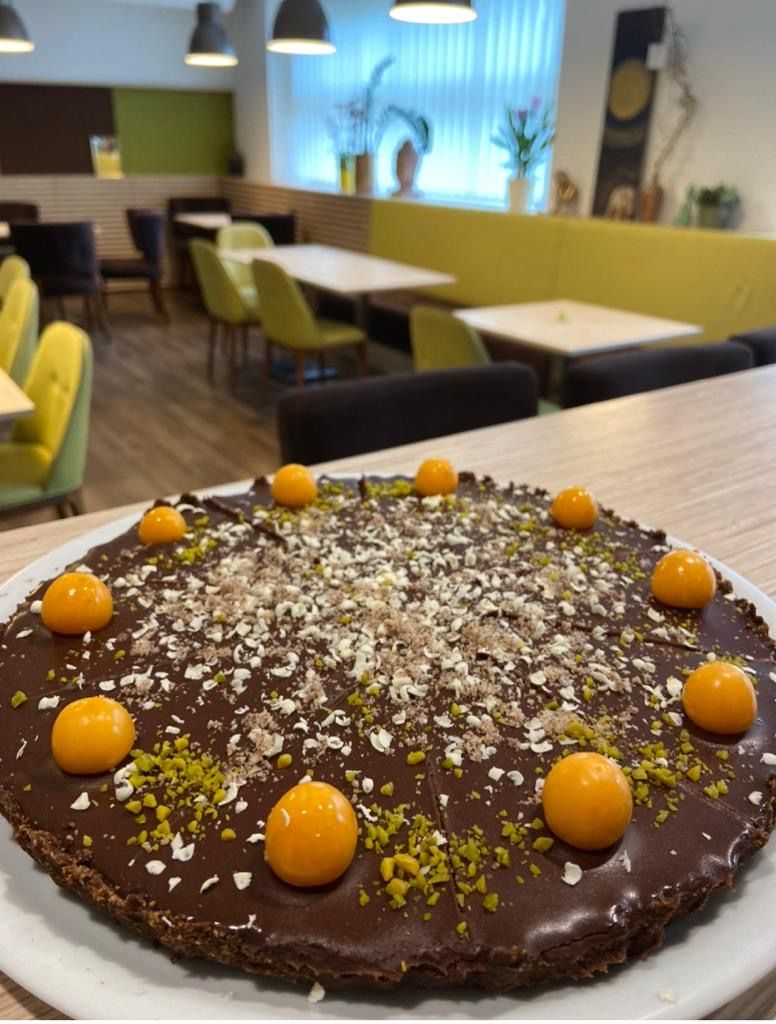 Chocolate cake with physalis in a café.