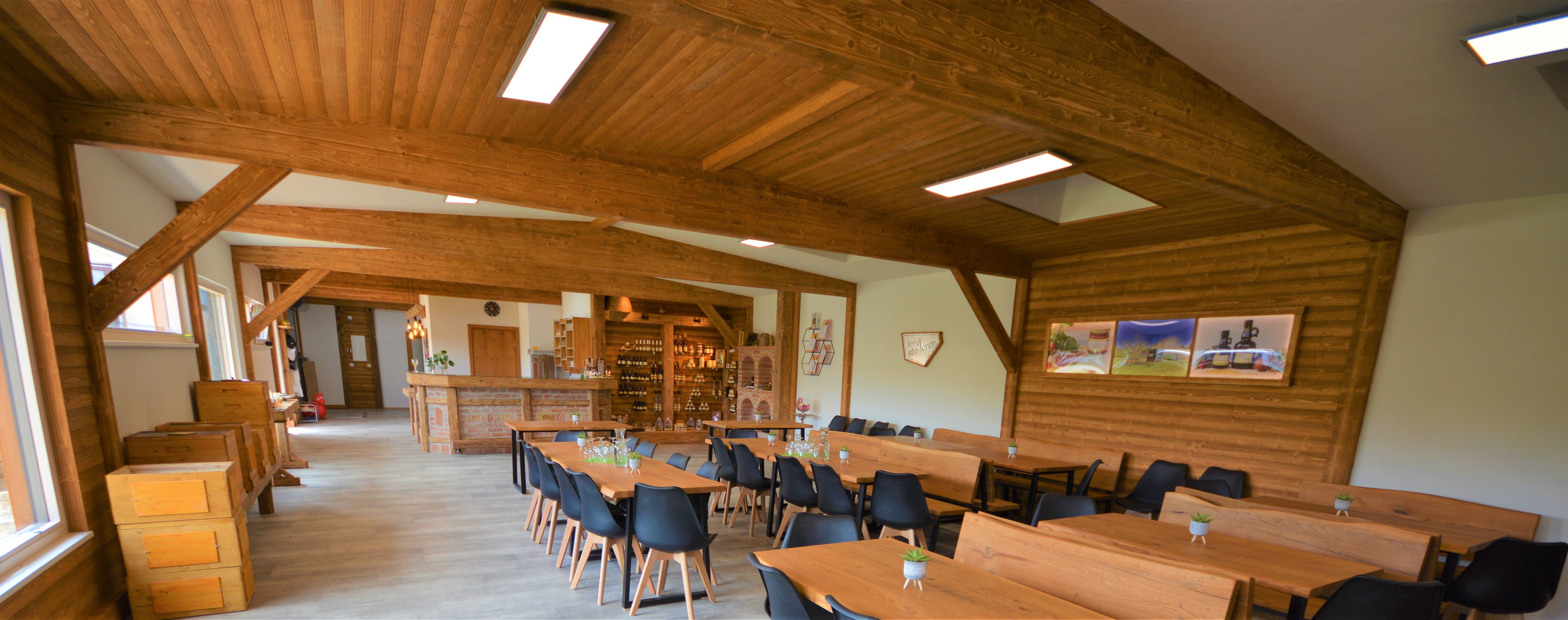 Interior view of a rustic room with wooden furniture and decorations.