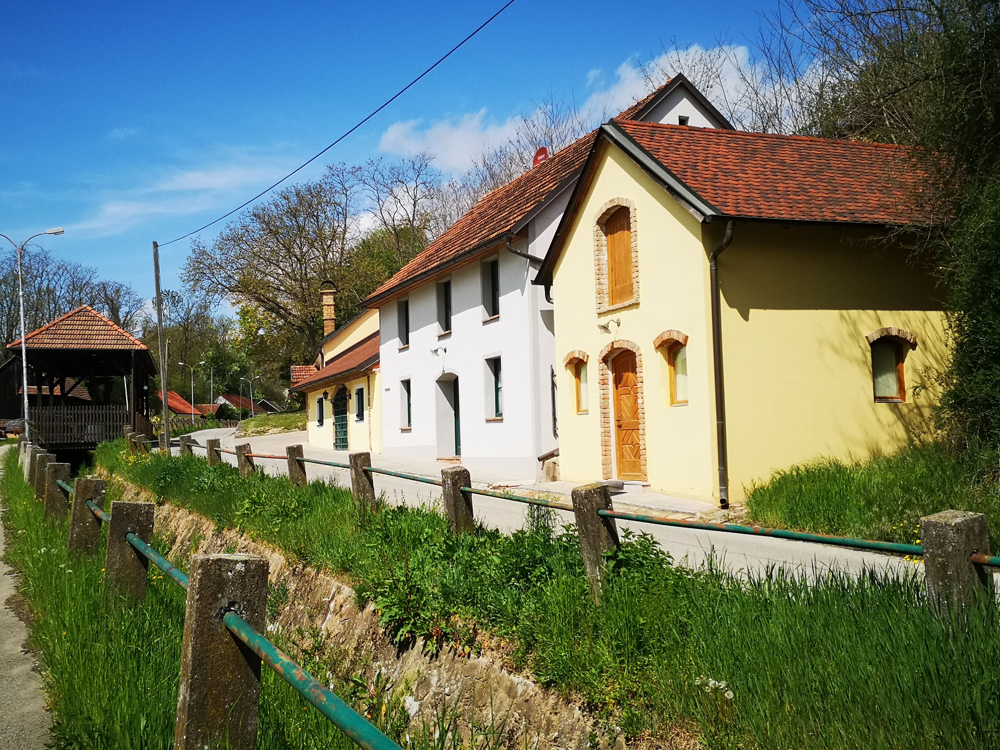 Traditional wine cellars in a wine cellar lane, surrounded by green spaces
