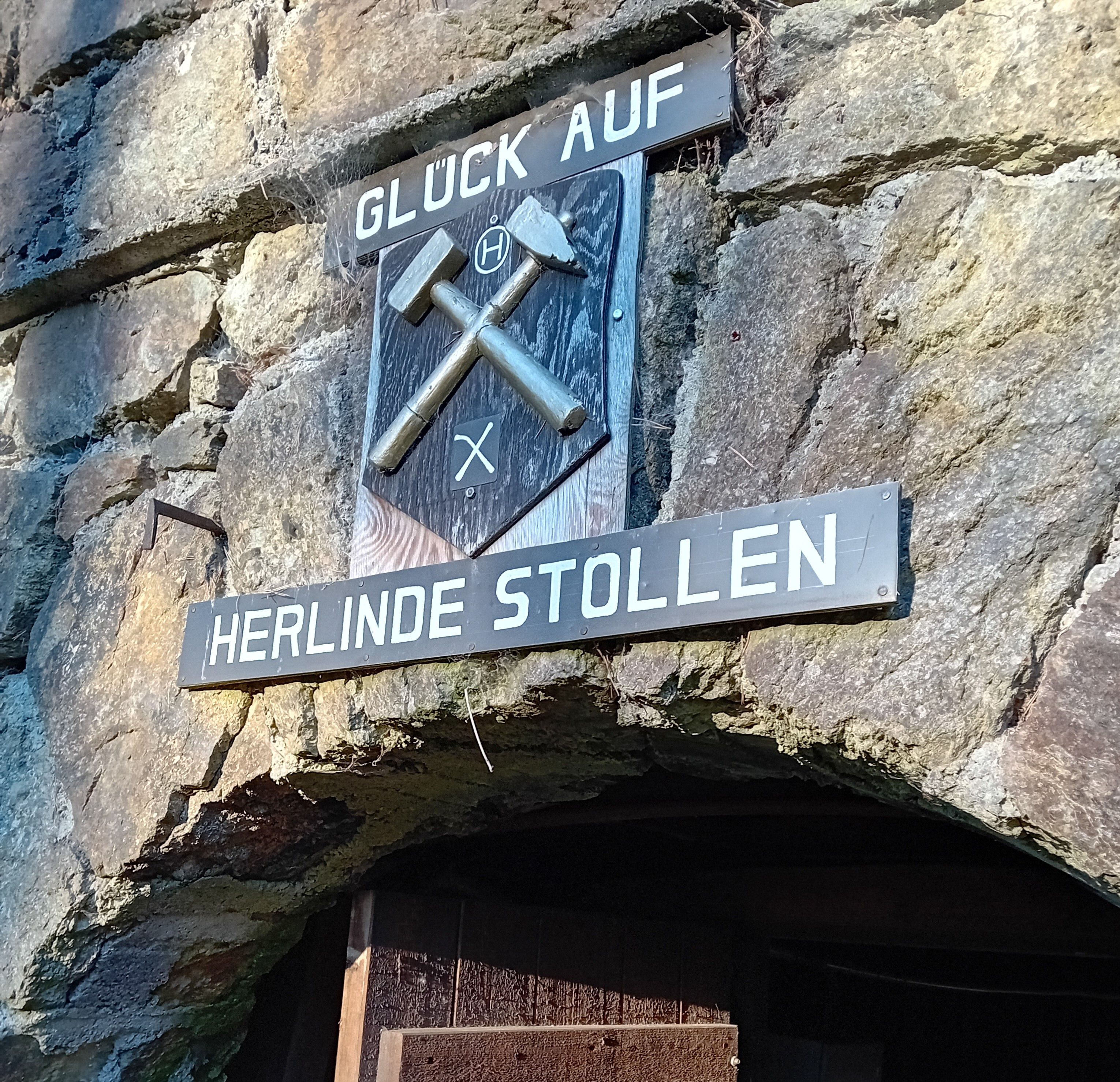 Entrance to the Herlinde gallery with mining sign and 'Glück Auf' lettering.