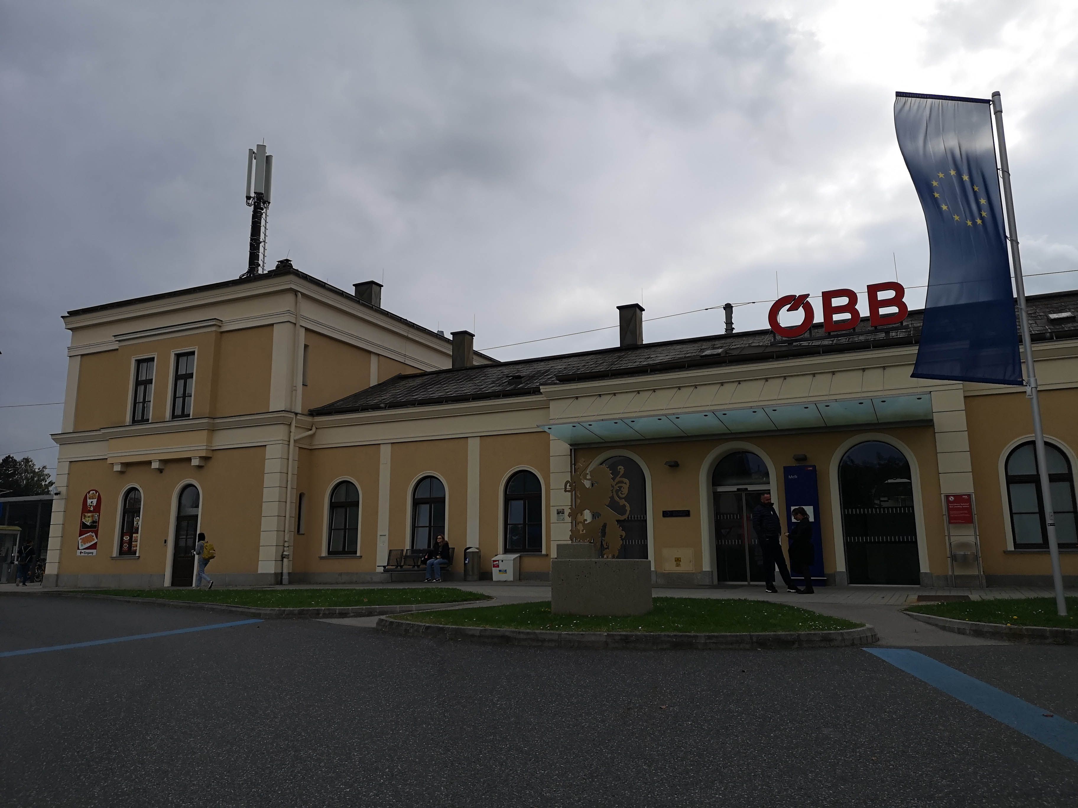 Melk station with ÖBB logo and EU flag.