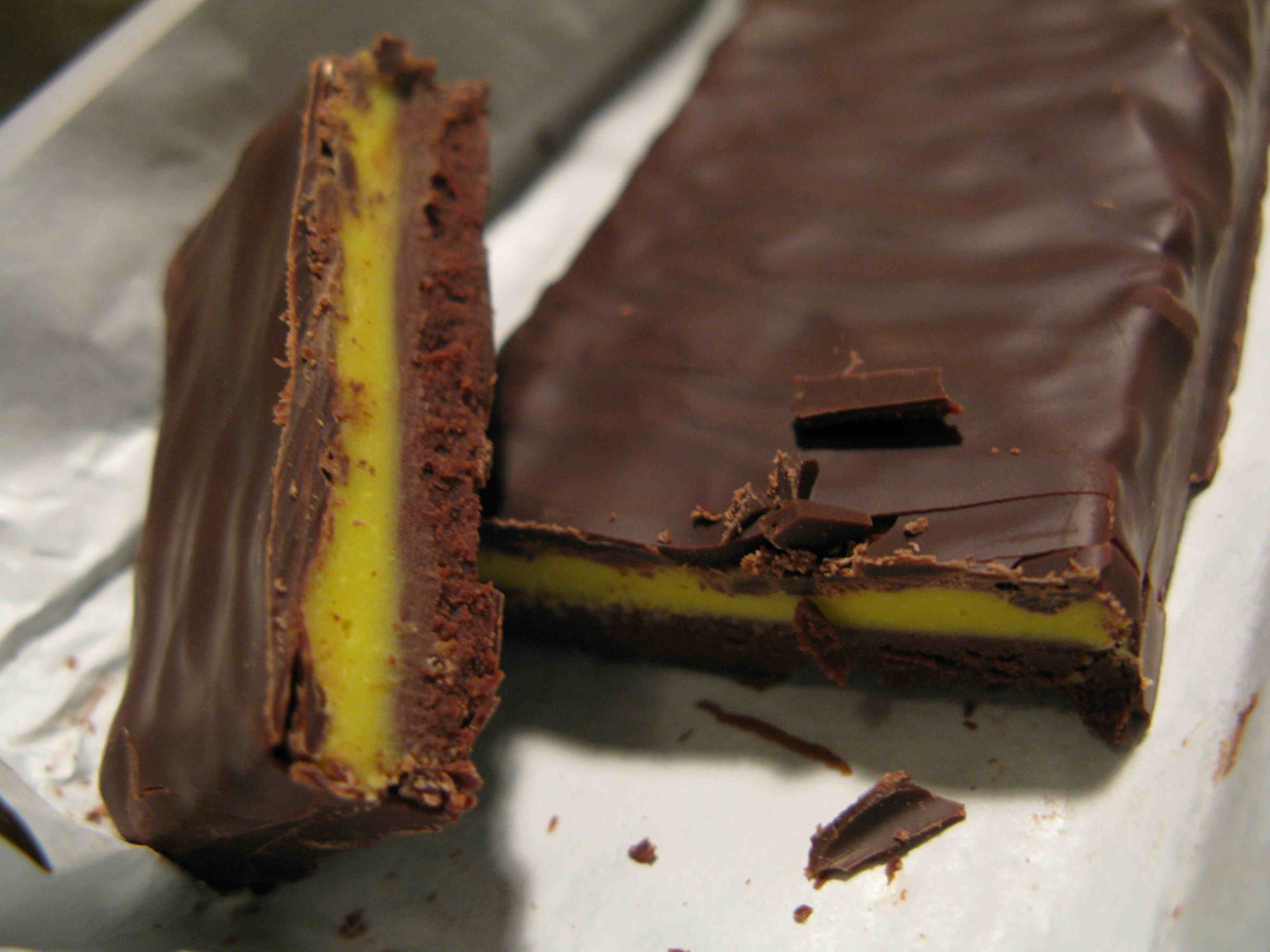 Close-up of a sliced chocolate bar with yellow filling.
