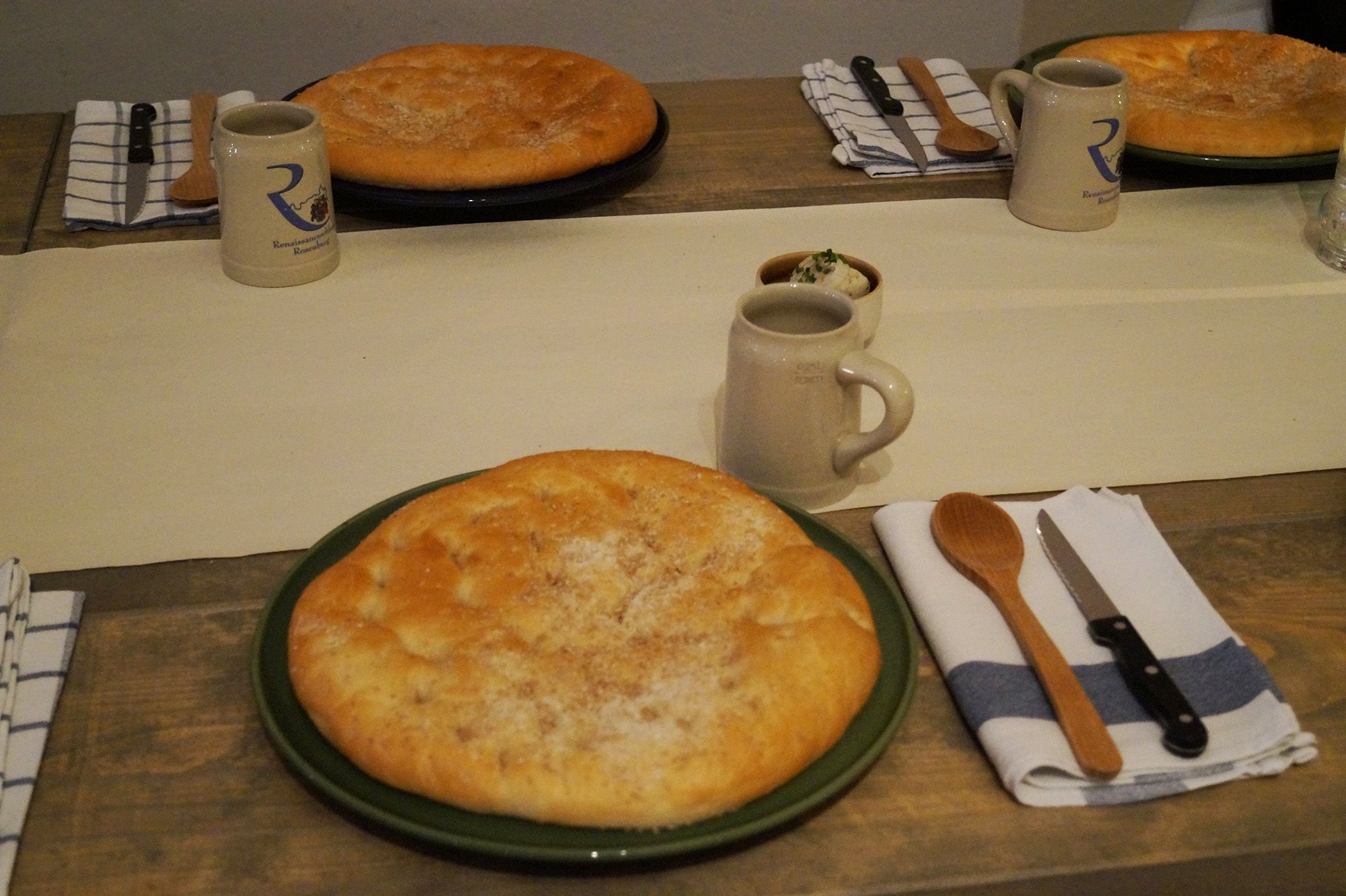 Table laid with bread, jugs and cutlery at Rosenburg Castle.