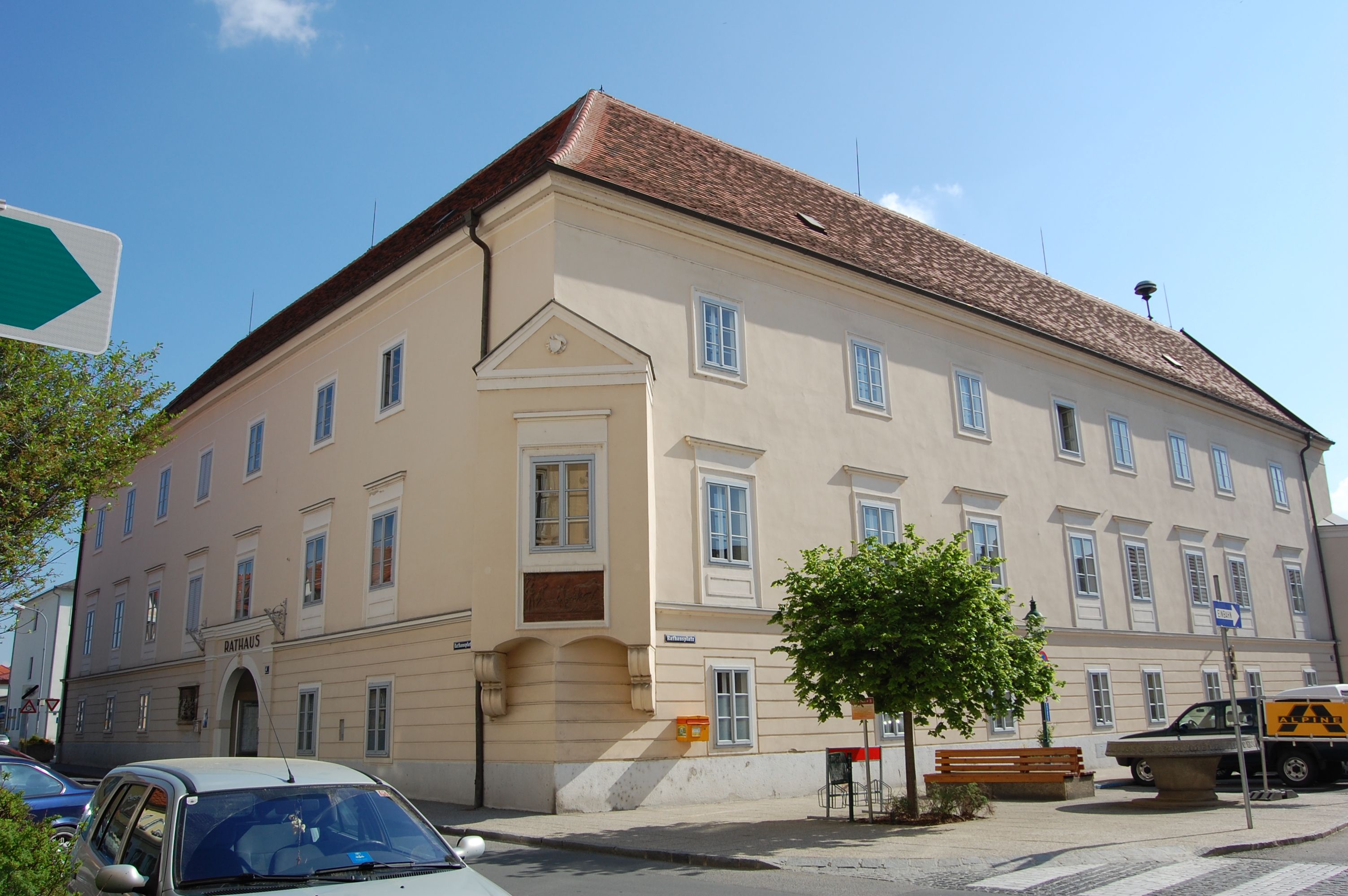 A large, bright building with red roof tiles and many windows, labeled 'Town Hall'.