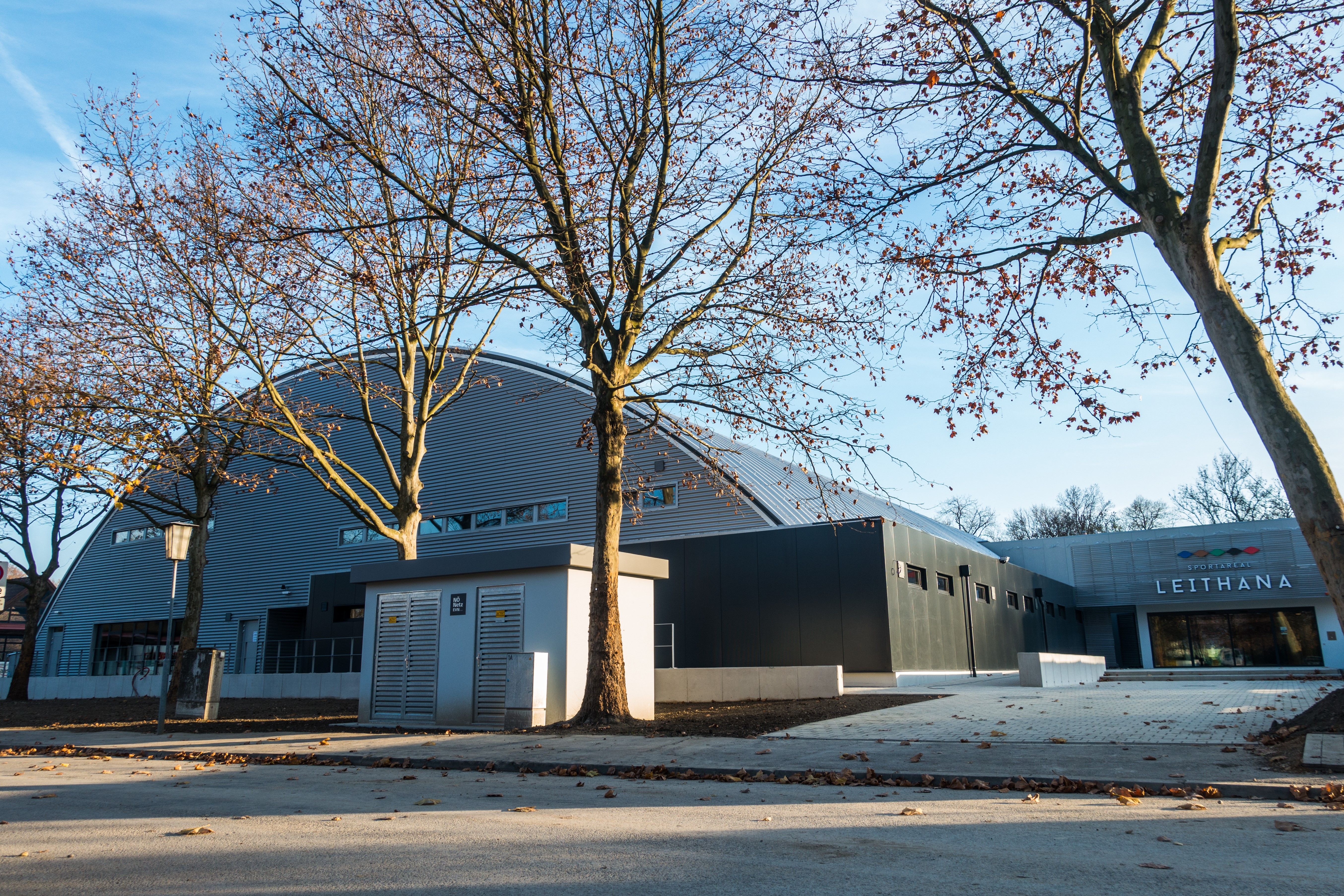 Exterior view of the Leithana sports area with bare trees in the foreground.