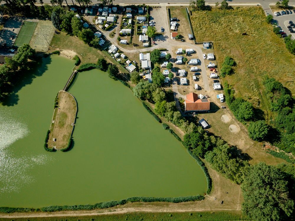 Aerial view of a bathing pond with campsite in Poysdorf.