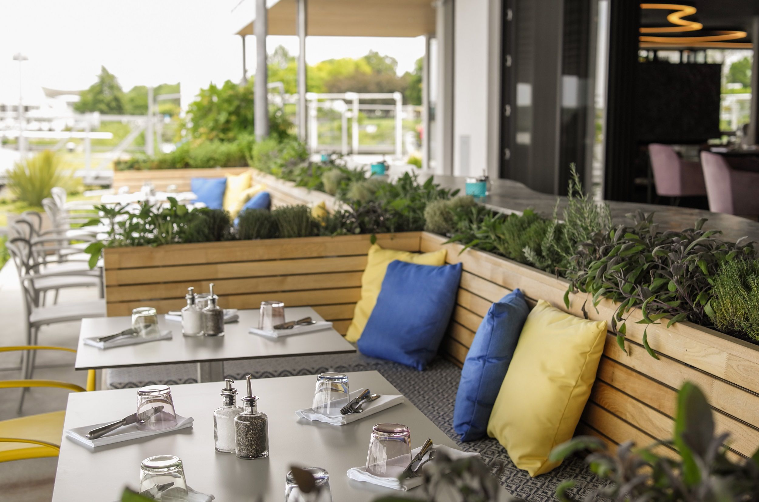 Terrace in summer with colorful cushions 