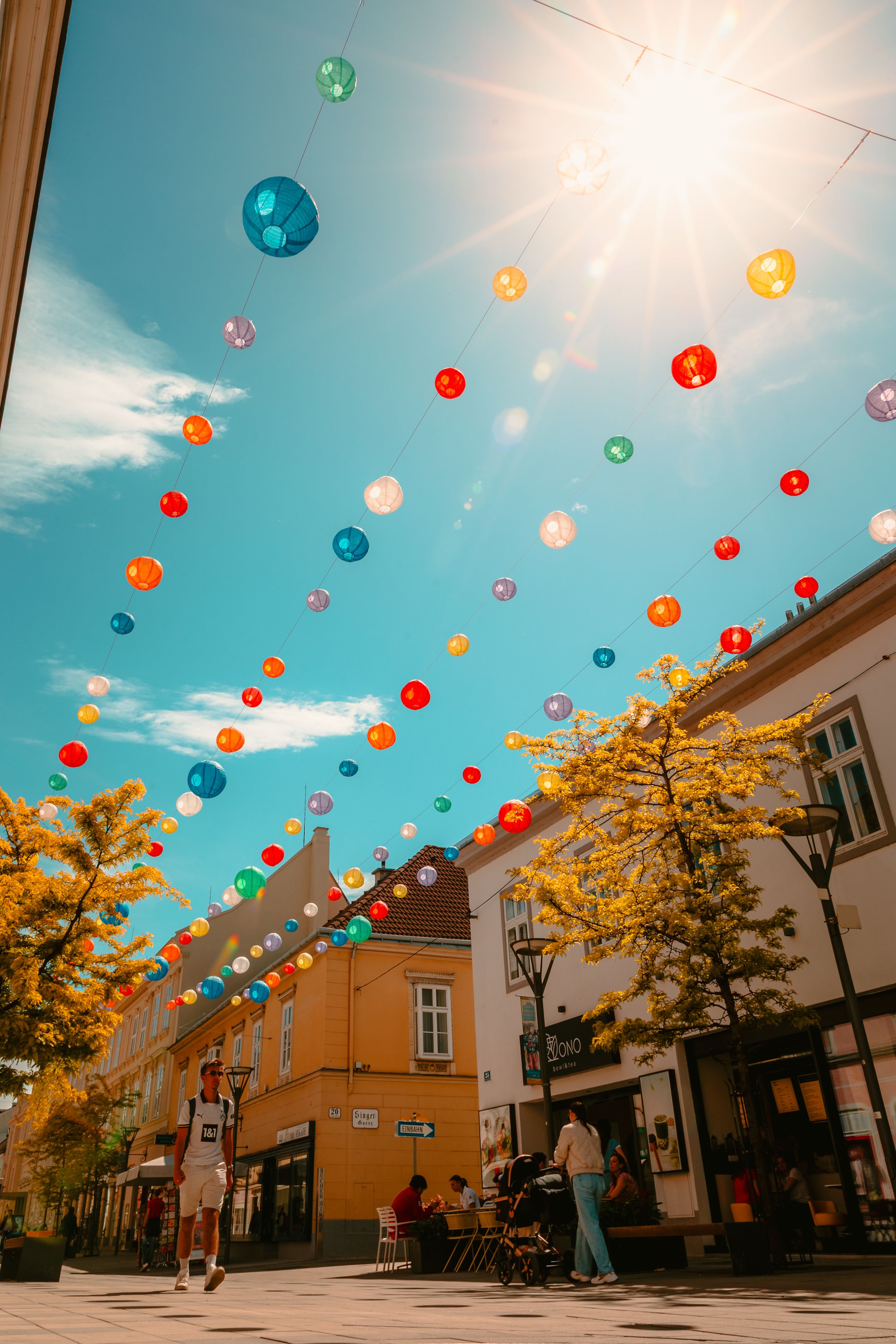 Colorful lanterns hanging over the streets of downtown