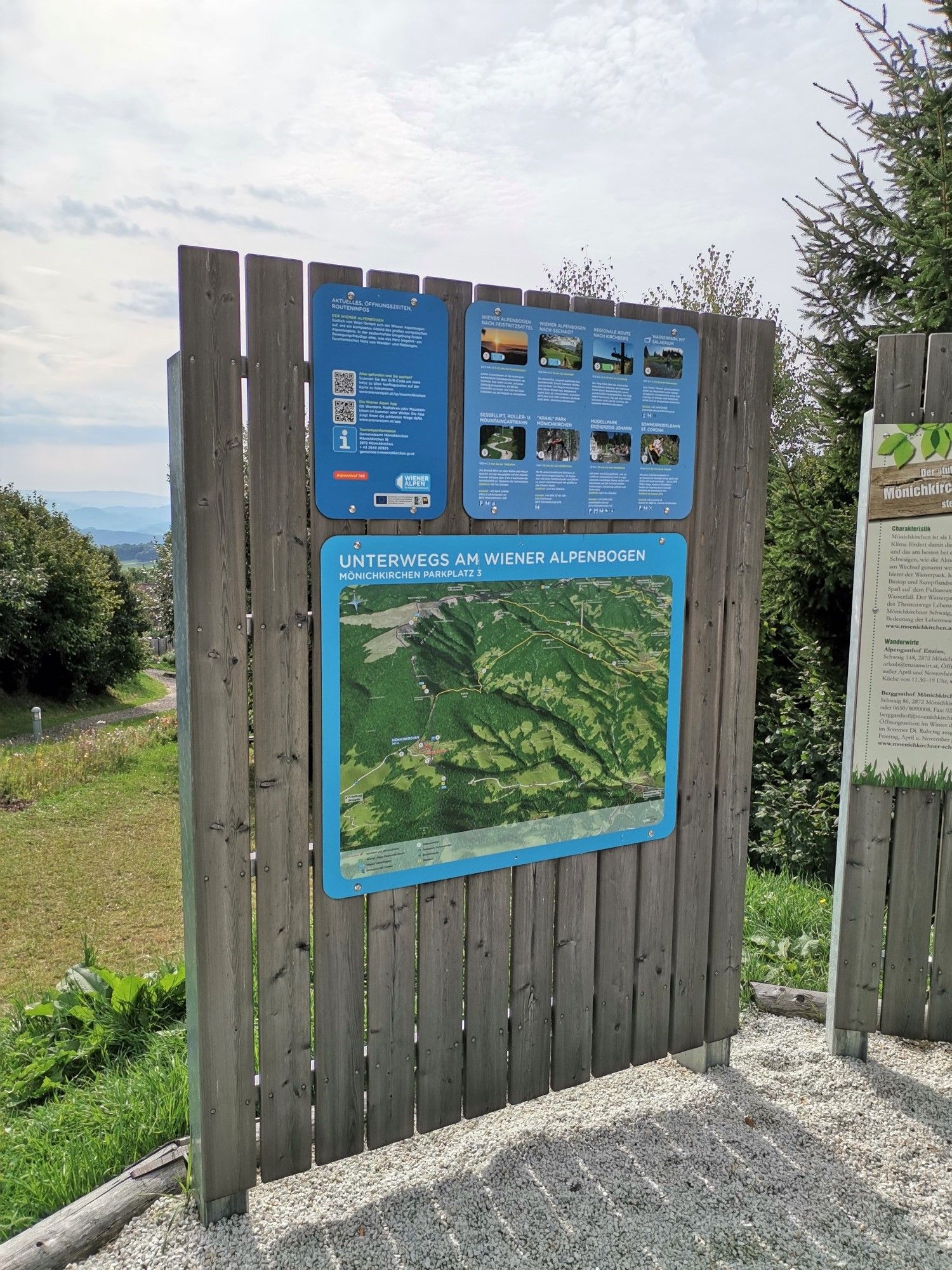 Information board at the Wiener Alpenbogen - Arc of the Viennese Alps (trail) with map and texts.
