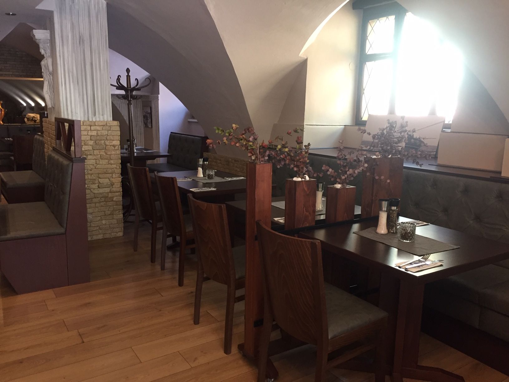 Tables in the vault with floral decorations 