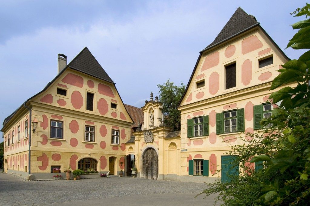 Historic building with ornate facades and archways.