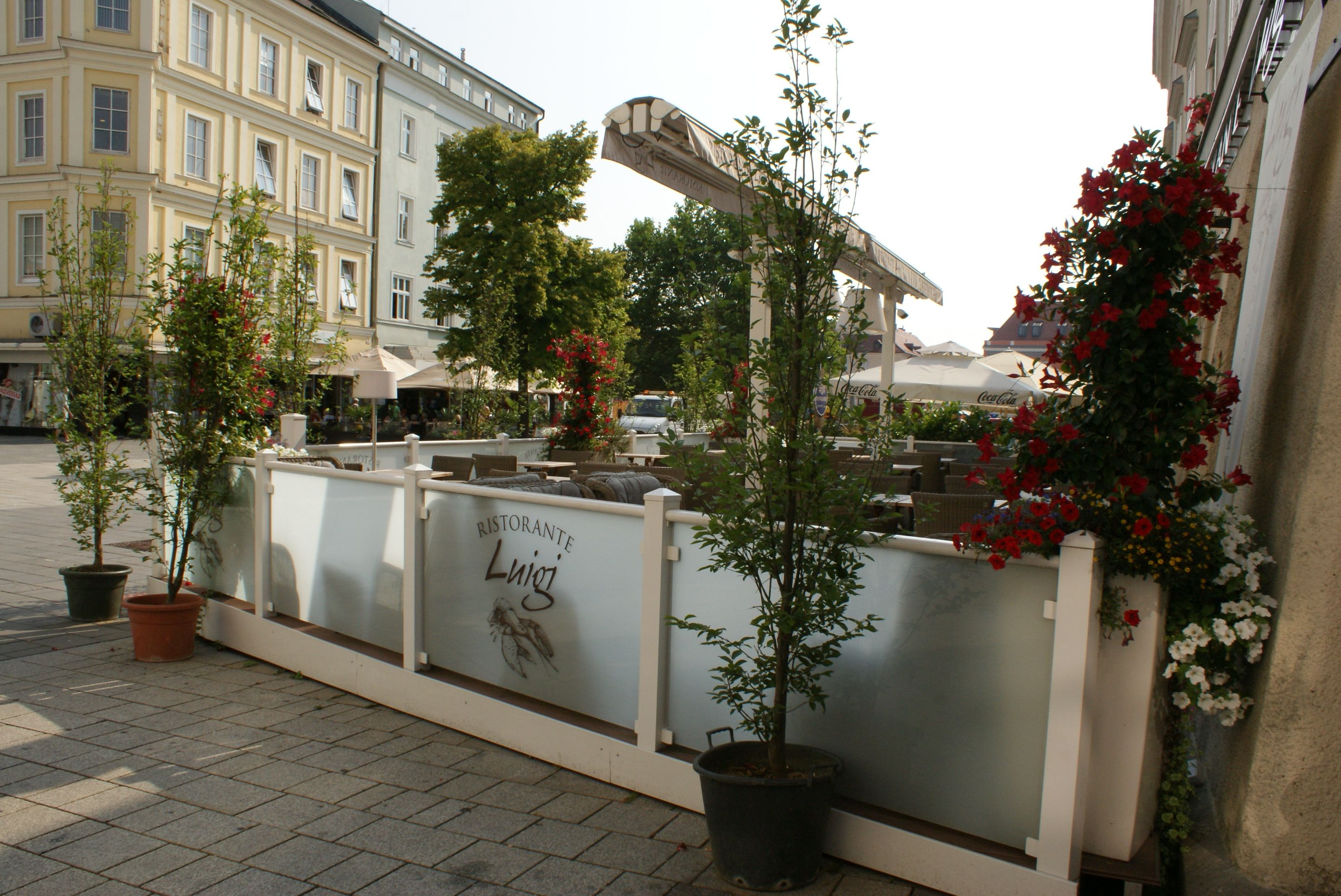 Outdoor area of Ristorante Luigi with plants and seating.