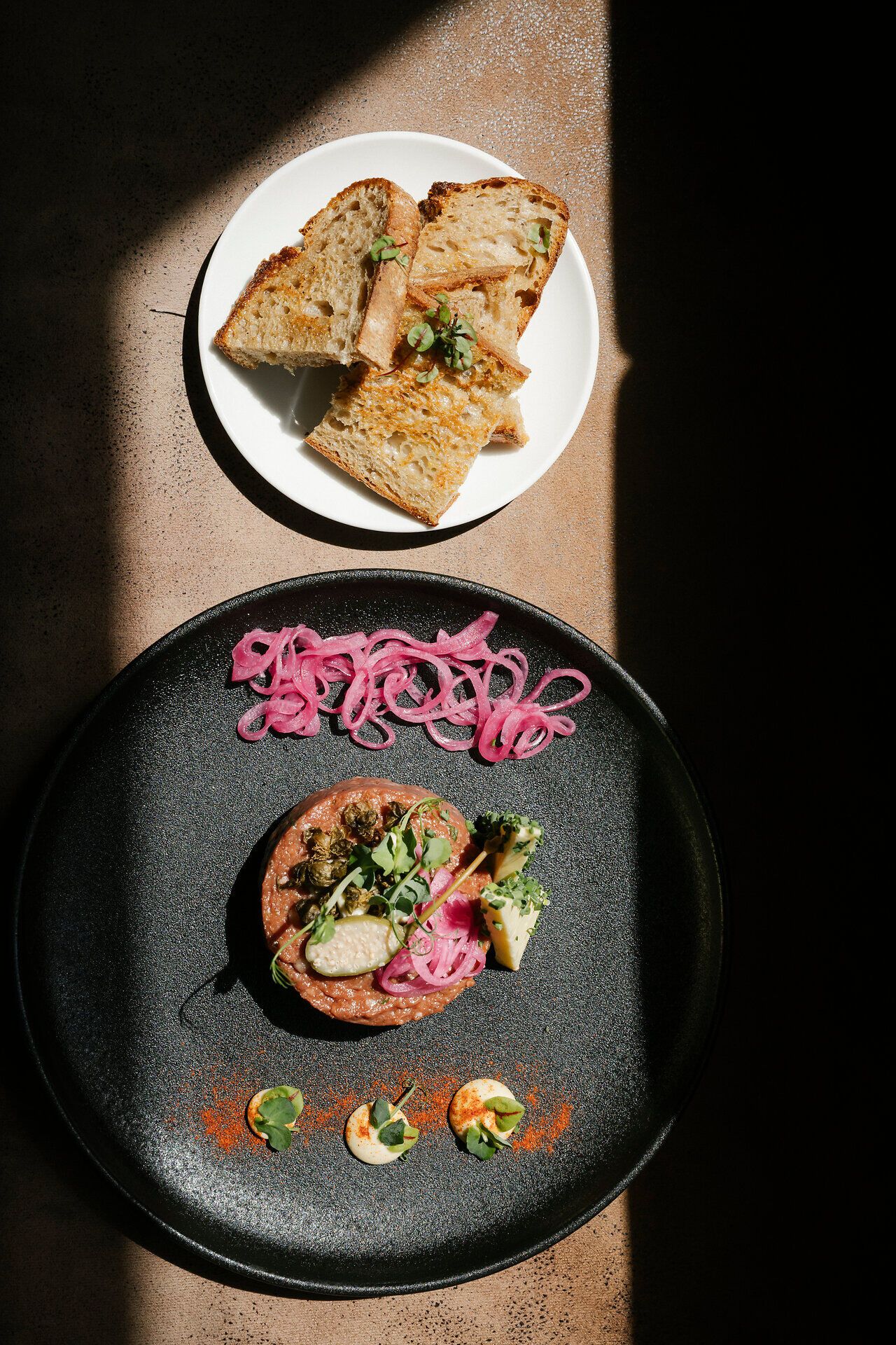 Artfully plated steak tartare with toasted bread