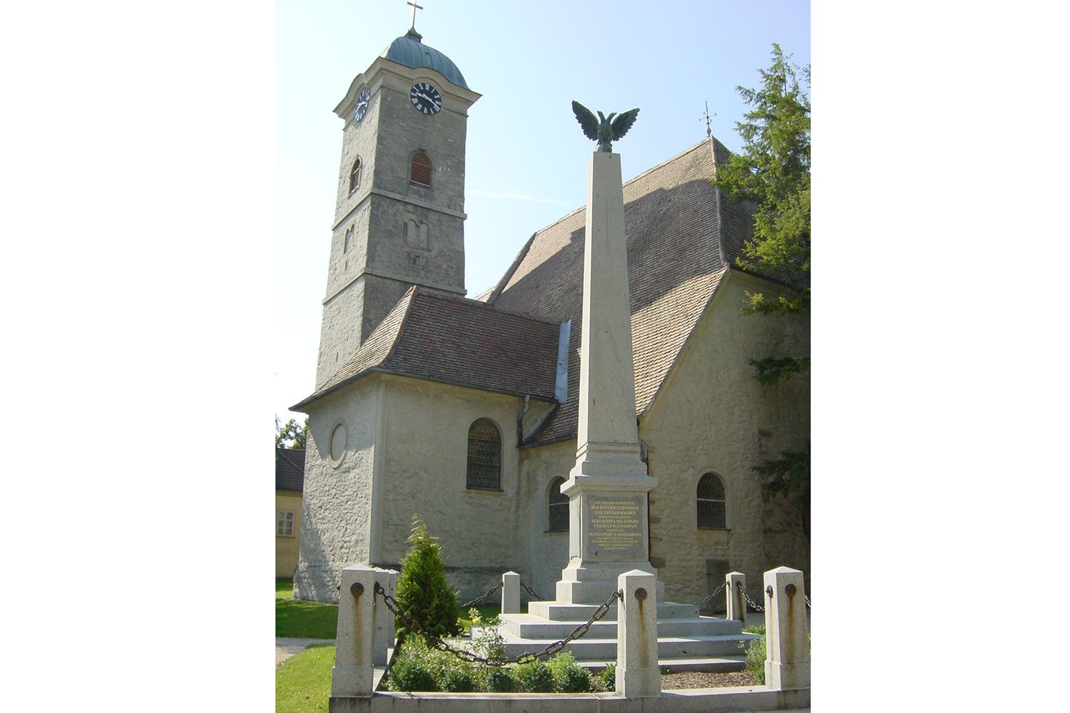 Church with tower and monument in Ulrichskirchen.