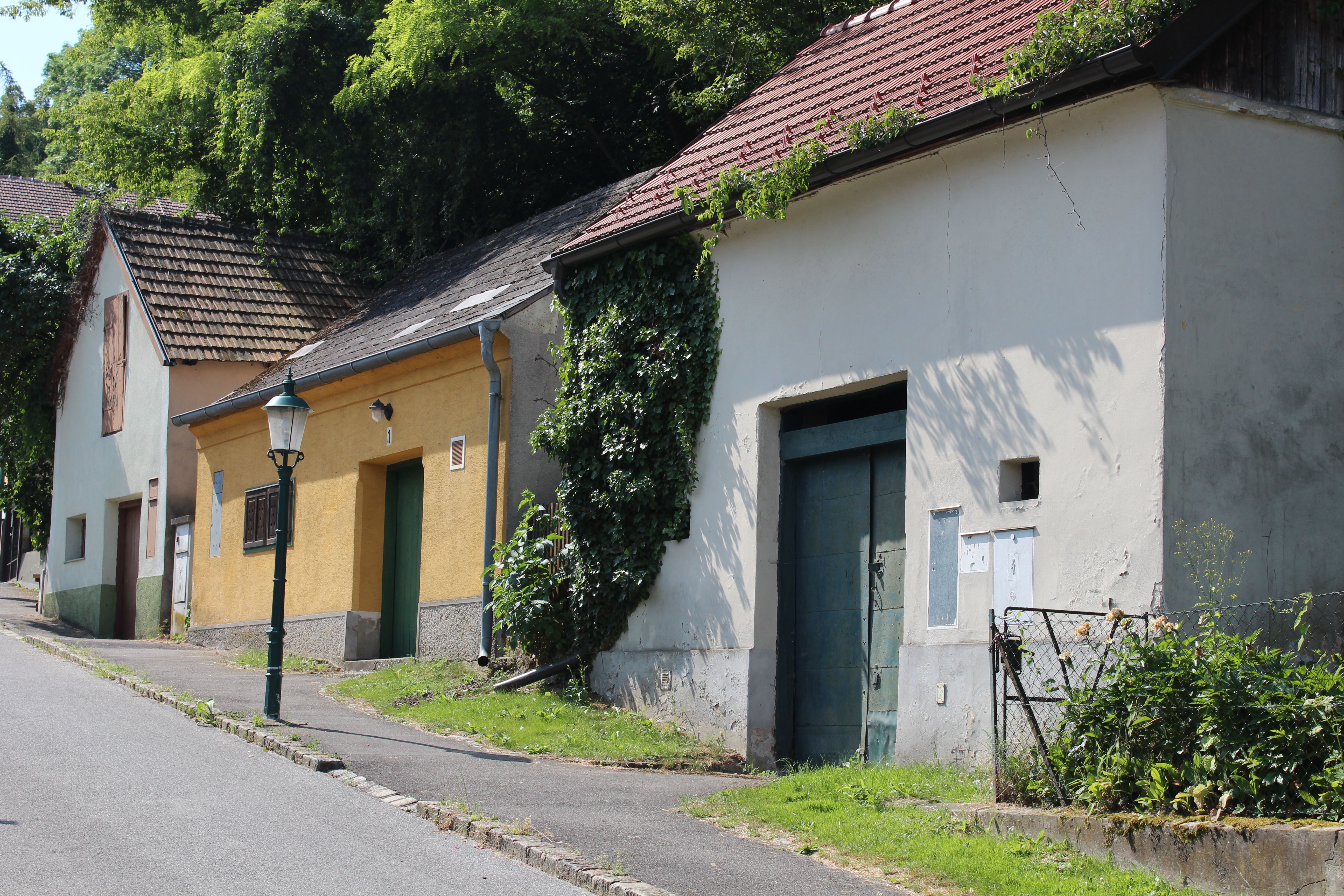 Wine cellar lane with old buildings and lantern in Bisamberg.