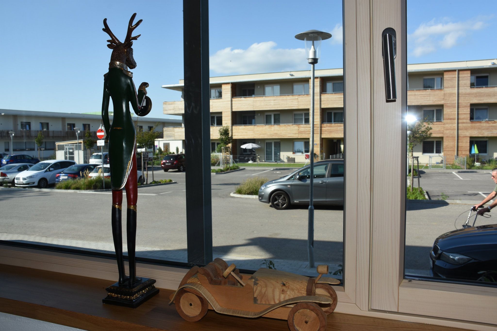 View of the large asphalt parking lot from inside.