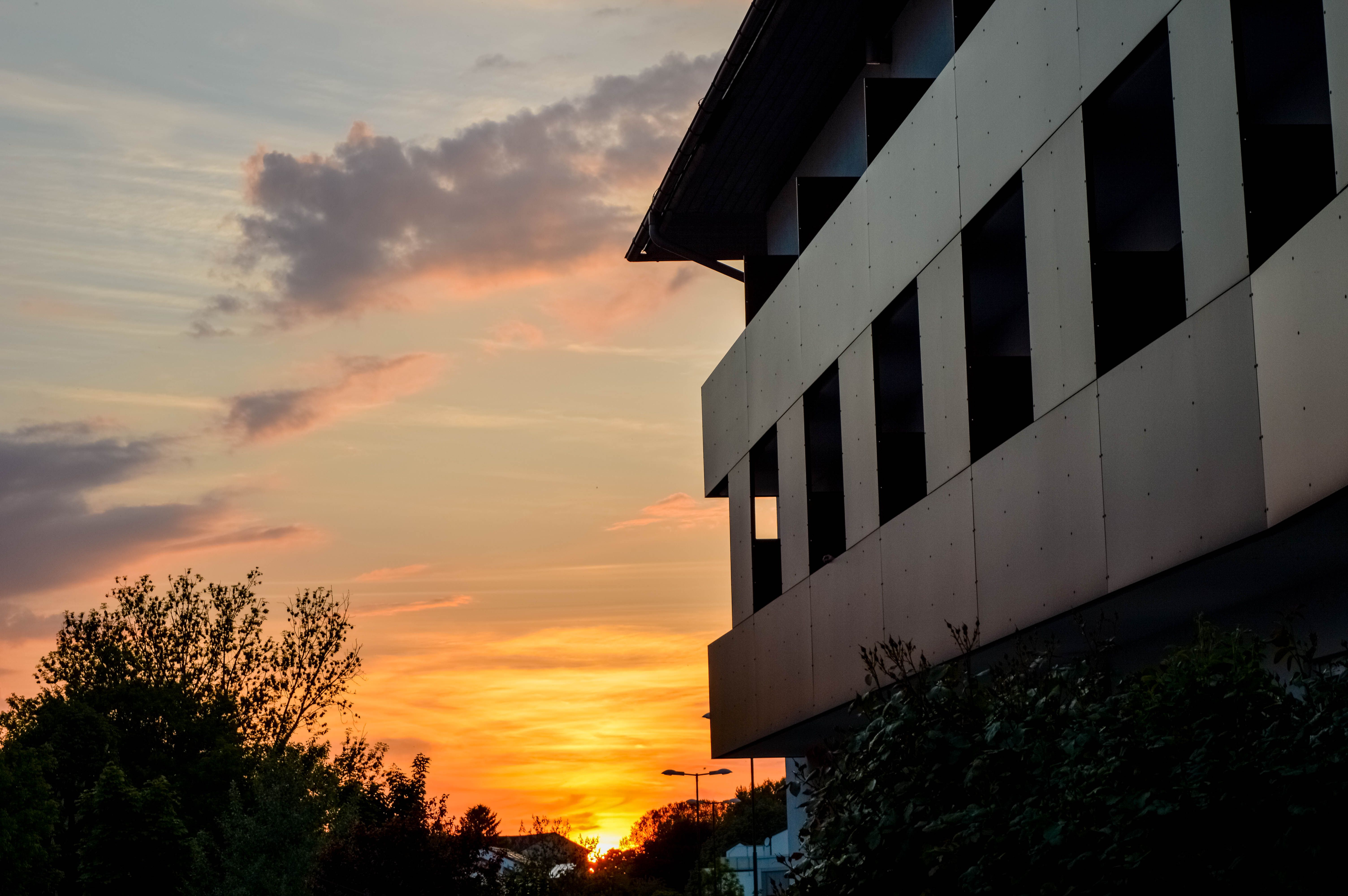 Exterior view of the hotel with sunset 