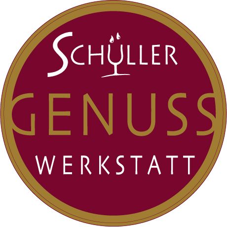 Schüller Genuss Werkstatt logo with red background and gold lettering.