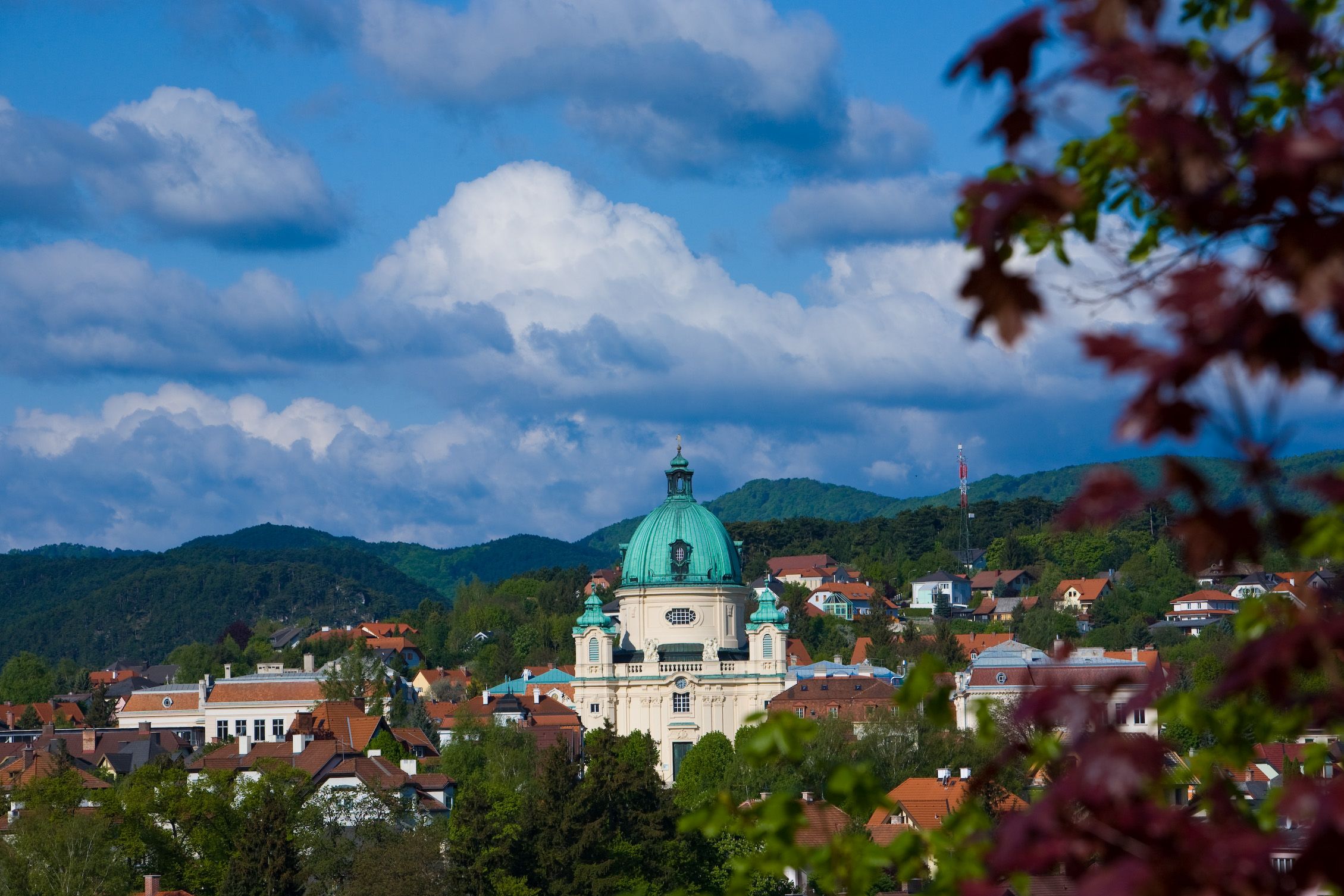 Town view of Berndorf with church and hills in the background.